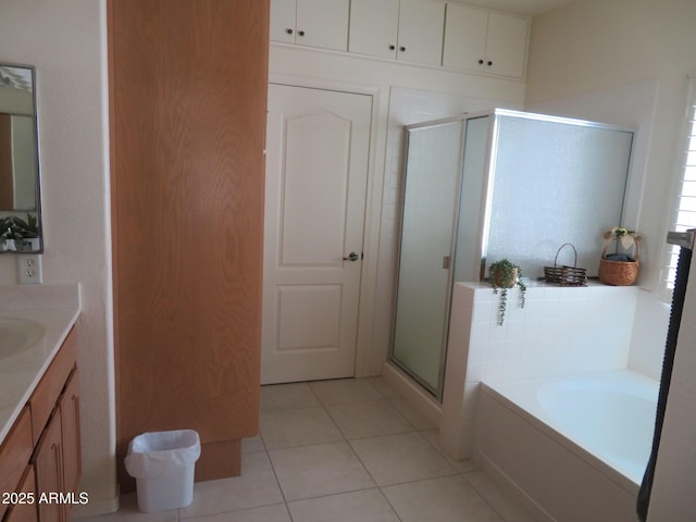 bathroom featuring vanity, tile patterned floors, a garden tub, and a stall shower