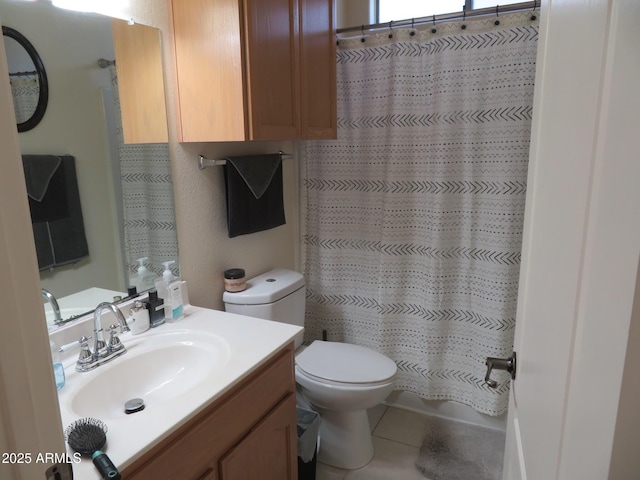 bathroom featuring toilet, tile patterned floors, a shower with shower curtain, and vanity