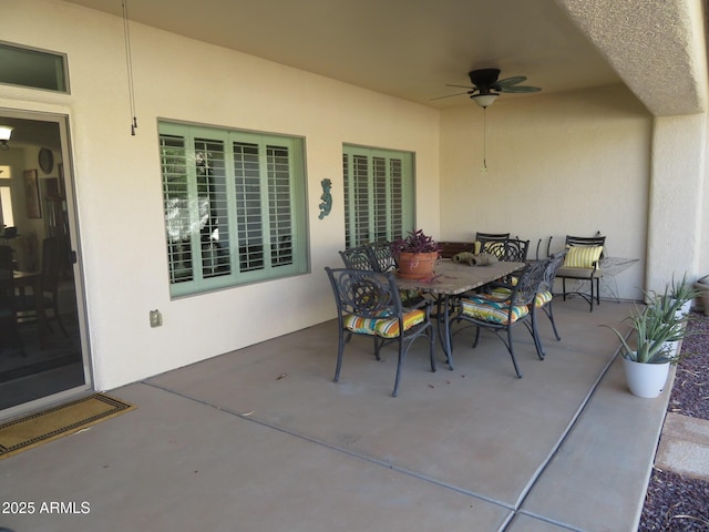 view of patio / terrace with a ceiling fan and outdoor dining area