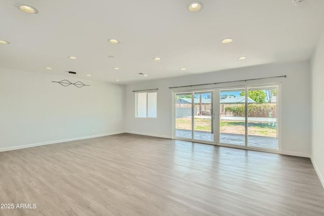 1930 E Missouri Ave, Phoenix, AZ 85016 - spare room featuring recessed lighting, wood finished floors, and baseboards