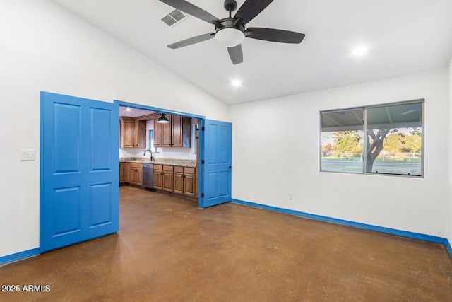 22914 W Sunland Ave, Buckeye, AZ 85326 - unfurnished living room with finished concrete floors, baseboards, a ceiling fan, a sink, and recessed lighting