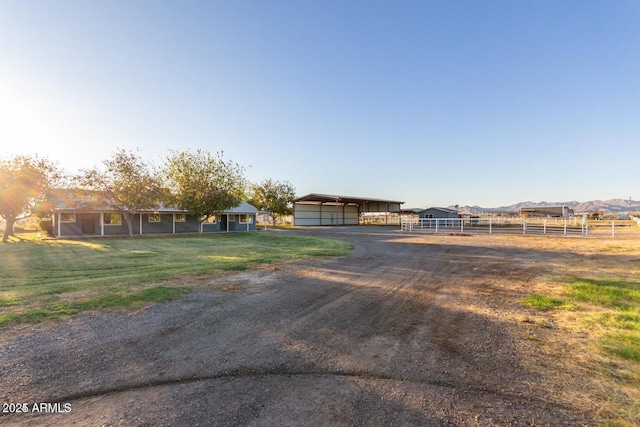 22914 W Sunland Ave, Buckeye, AZ 85326 - view of front of home featuring a carport and driveway
