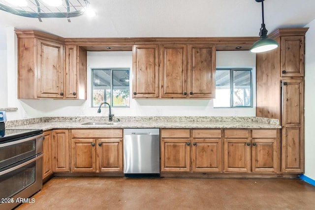 22914 W Sunland Ave, Buckeye, AZ 85326 - kitchen with appliances with stainless steel finishes, a sink, finished concrete flooring, and brown cabinetry