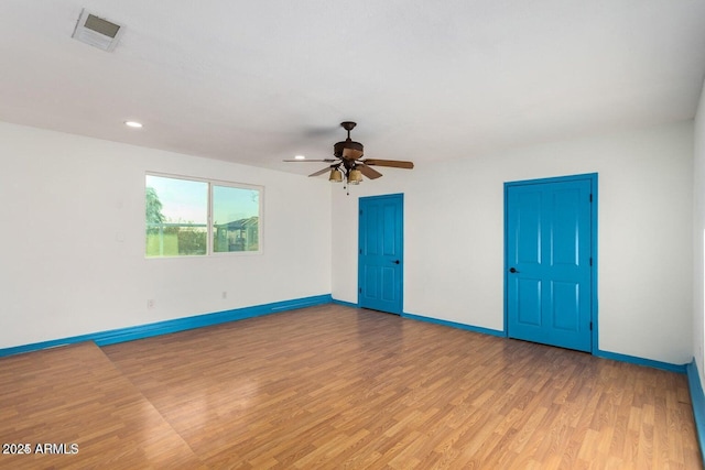 22914 W Sunland Ave, Buckeye, AZ 85326 - unfurnished room with light wood finished floors, baseboards, ceiling fan, and recessed lighting