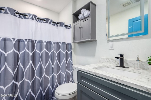 22914 W Sunland Ave, Buckeye, AZ 85326 - full bathroom with toilet, vanity, and curtained shower
