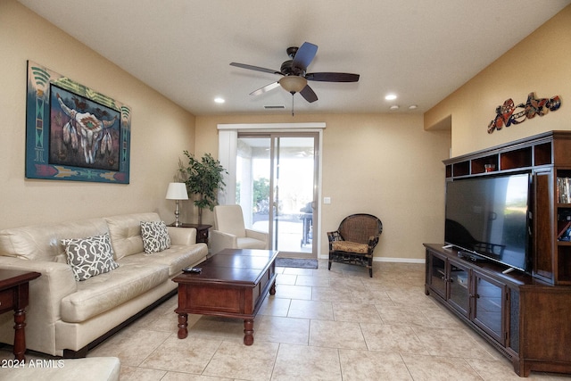 living room with ceiling fan and light tile patterned flooring