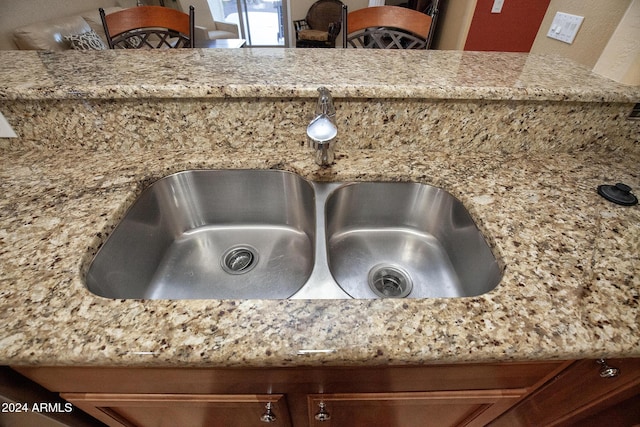 details with light stone countertops and sink