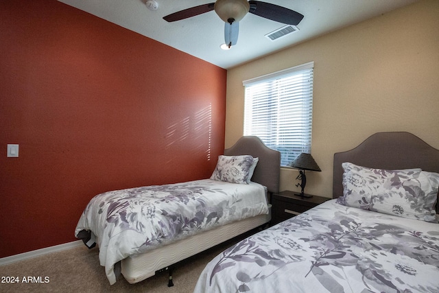 carpeted bedroom featuring vaulted ceiling and ceiling fan