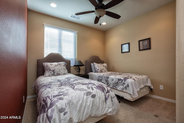 carpeted bedroom with ceiling fan