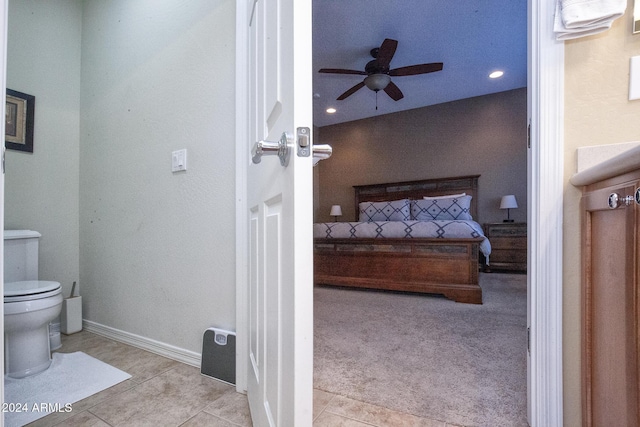 bathroom with tile patterned floors, ceiling fan, and toilet