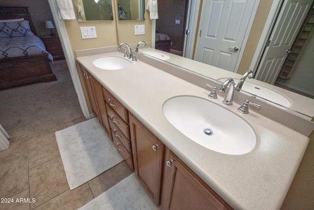 bathroom with tile patterned flooring and vanity