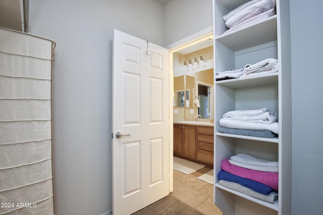 bathroom with tile patterned floors and vanity