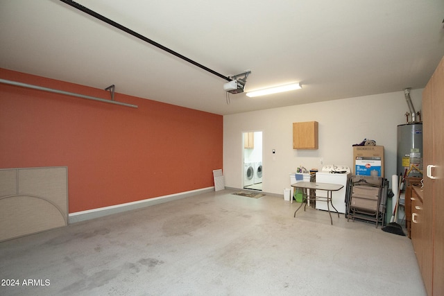 garage featuring washer and dryer and a garage door opener