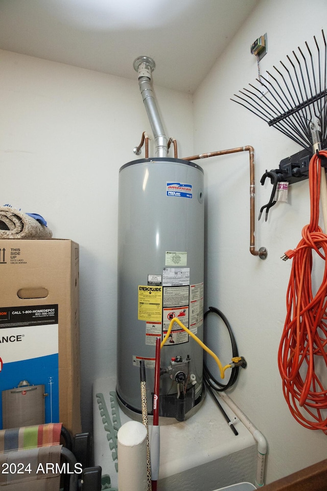 utility room featuring gas water heater