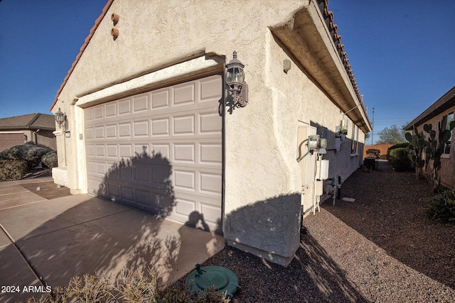 view of property exterior featuring a garage