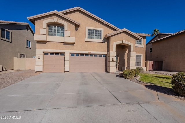 mediterranean / spanish home with a garage