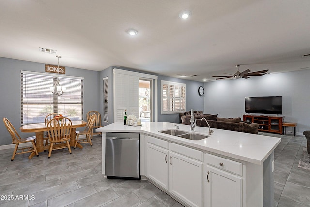 kitchen featuring sink, white cabinetry, dishwasher, a center island with sink, and pendant lighting