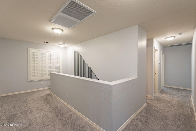 hallway featuring carpet