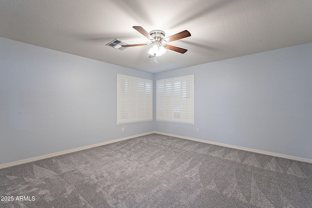 unfurnished room with carpet floors, ceiling fan, and a textured ceiling