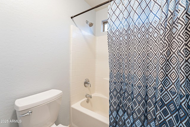 bathroom featuring toilet and shower / tub combo with curtain