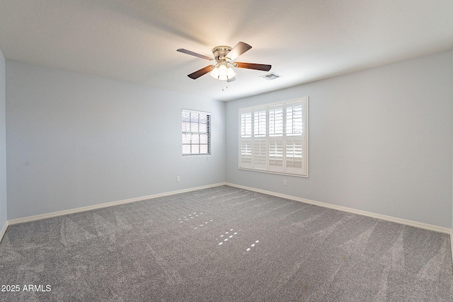 carpeted empty room featuring ceiling fan