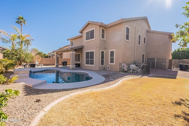 view of swimming pool with a patio