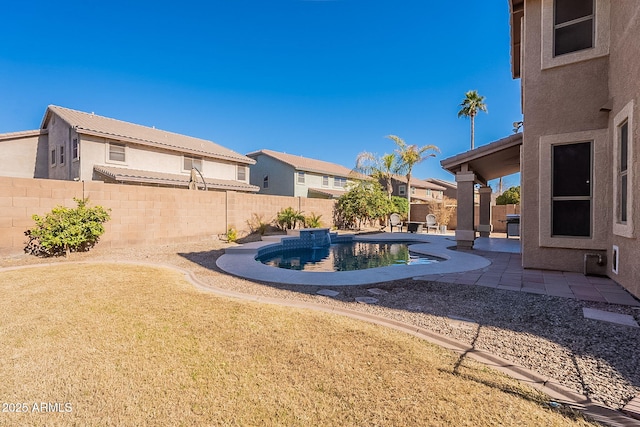 view of yard featuring a fenced in pool and a patio