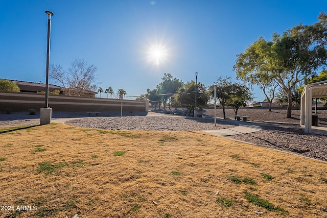 view of yard featuring volleyball court