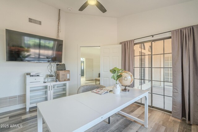 office space featuring light hardwood / wood-style floors and ceiling fan