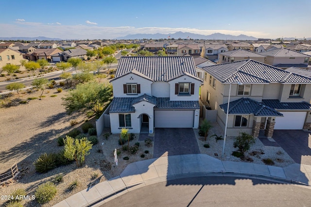 birds eye view of property featuring a mountain view