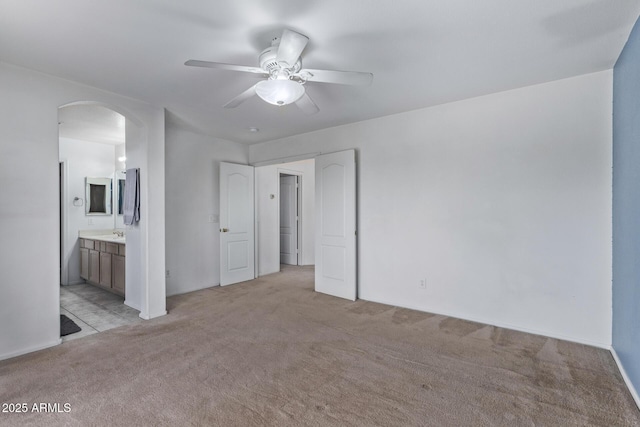 spare room with light carpet and ceiling fan