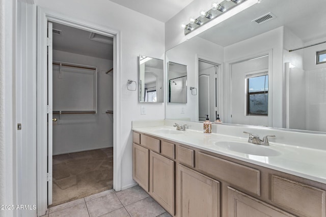 bathroom with tile patterned flooring and vanity