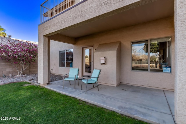 view of patio with a balcony