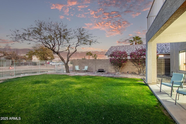 yard at dusk with a patio