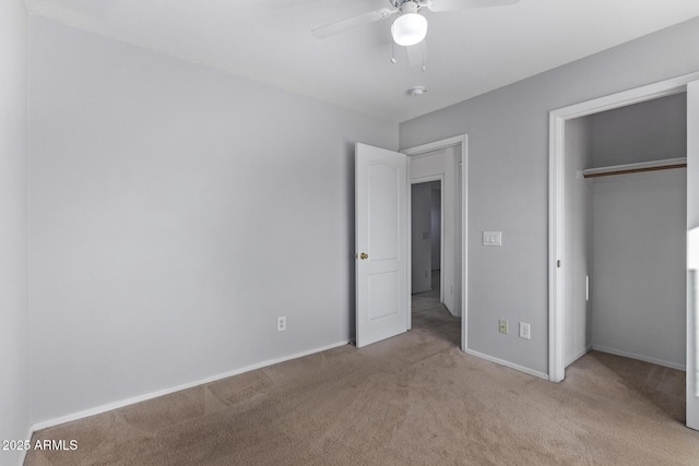 unfurnished bedroom with light colored carpet, a closet, and ceiling fan