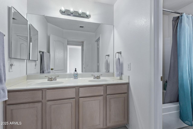 bathroom with vanity and shower / bath combo with shower curtain