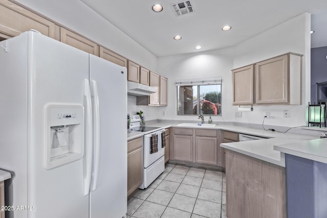 kitchen featuring light tile patterned flooring, sink, light brown cabinets, and white appliances