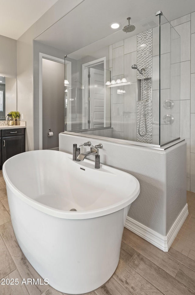 bathroom with vanity and plus walk in shower