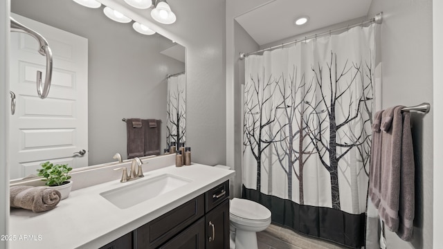 bathroom with vanity, hardwood / wood-style flooring, toilet, and a shower with shower curtain