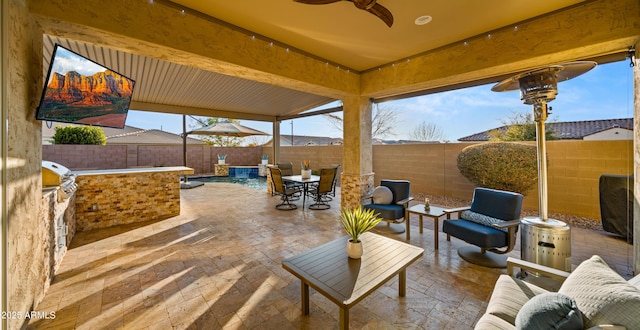 view of patio / terrace with ceiling fan and area for grilling