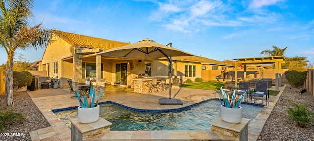 rear view of property with a patio and a bar