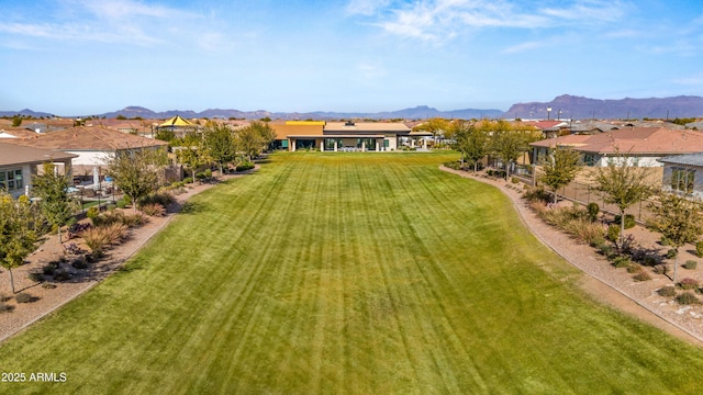 birds eye view of property with a mountain view