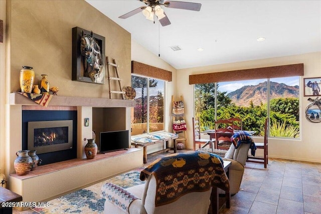 10796 N Saddle Pass Rd, Prescott, AZ 86305 - living area with lofted ceiling, a ceiling fan, a warm lit fireplace, and recessed lighting