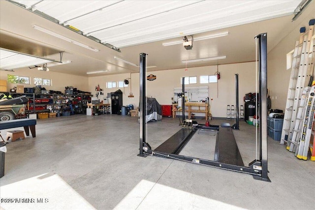 10796 N Saddle Pass Rd, Prescott, AZ 86305 - garage featuring a workshop area and a garage door opener