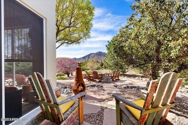 10796 N Saddle Pass Rd, Prescott, AZ 86305 - view of patio / terrace featuring a mountain view and a fire pit