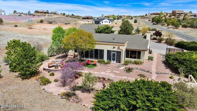 10796 N Saddle Pass Rd, Prescott, AZ 86305 - back of property featuring a sunroom and stucco siding
