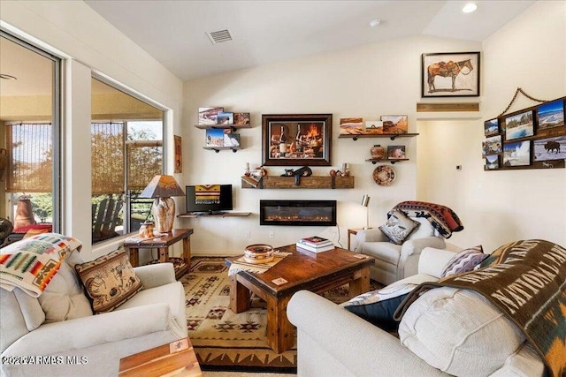 10796 N Saddle Pass Rd, Prescott, AZ 86305 - living area featuring vaulted ceiling, a glass covered fireplace, and recessed lighting