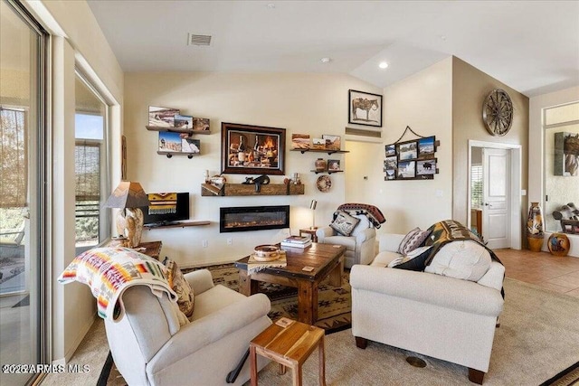 10796 N Saddle Pass Rd, Prescott, AZ 86305 - tiled living room featuring a glass covered fireplace, lofted ceiling, and recessed lighting