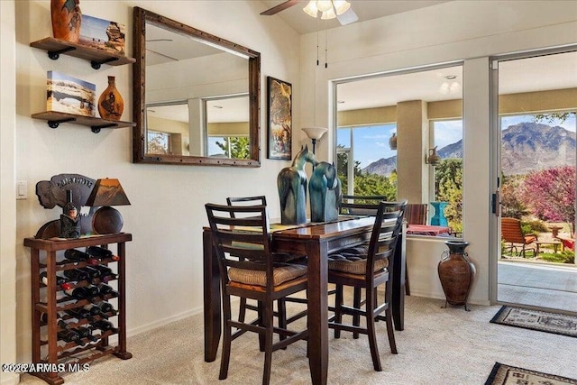 10796 N Saddle Pass Rd, Prescott, AZ 86305 - dining room with carpet, ceiling fan, and a mountain view
