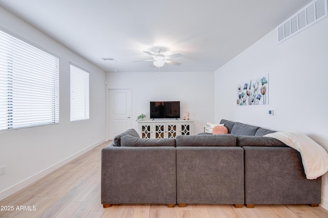 2511 W Queen Creek Rd Unit 374, Chandler, AZ 85248 - living room featuring ceiling fan, light wood finished floors, and baseboards